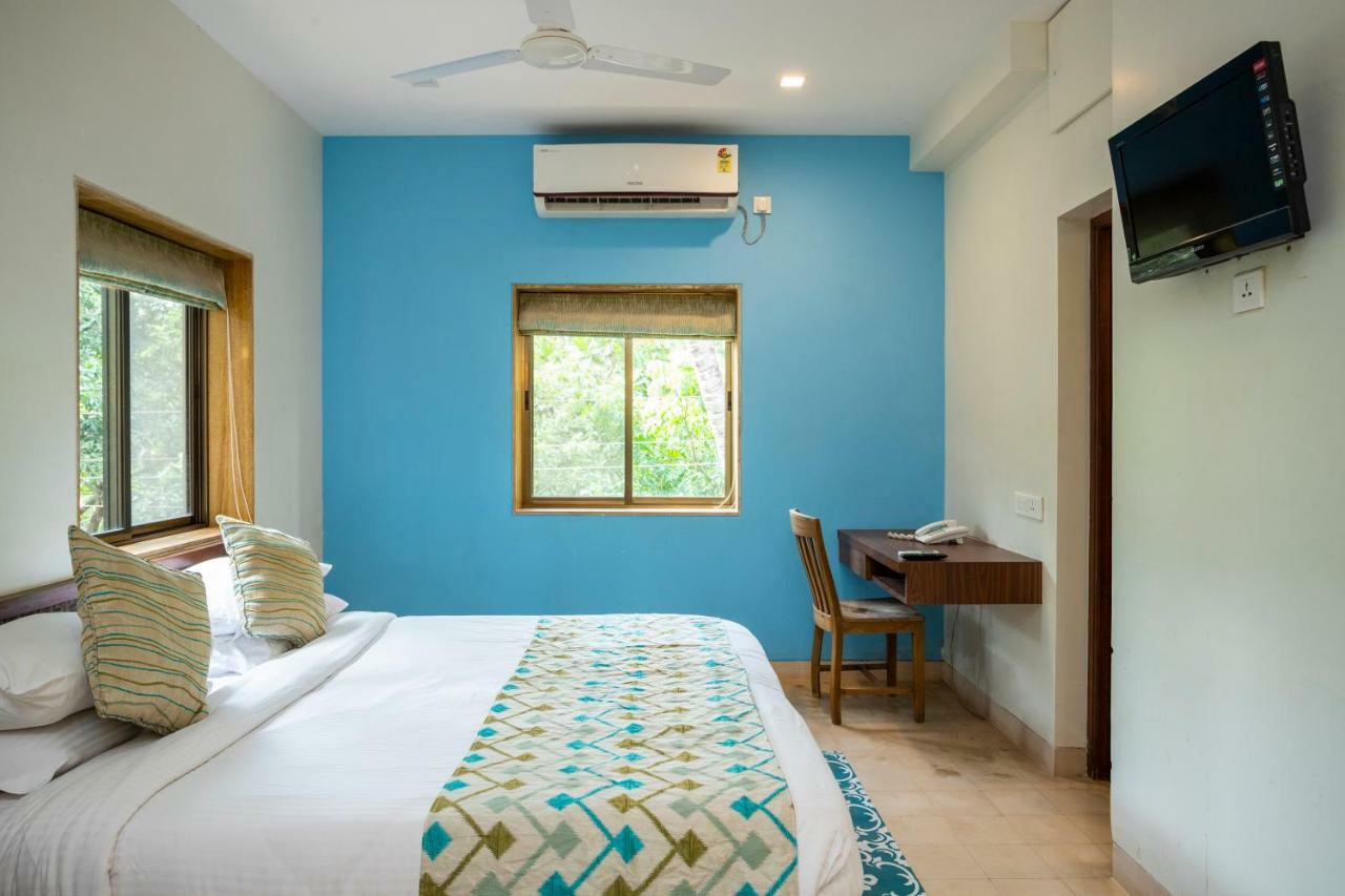 Hotel Coco Goa à Arpora Extérieur photo